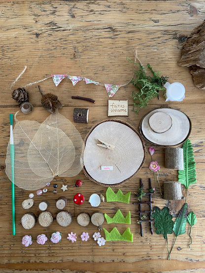 DIY fairy tree house with table, step ladder and tiny liberty print bunting